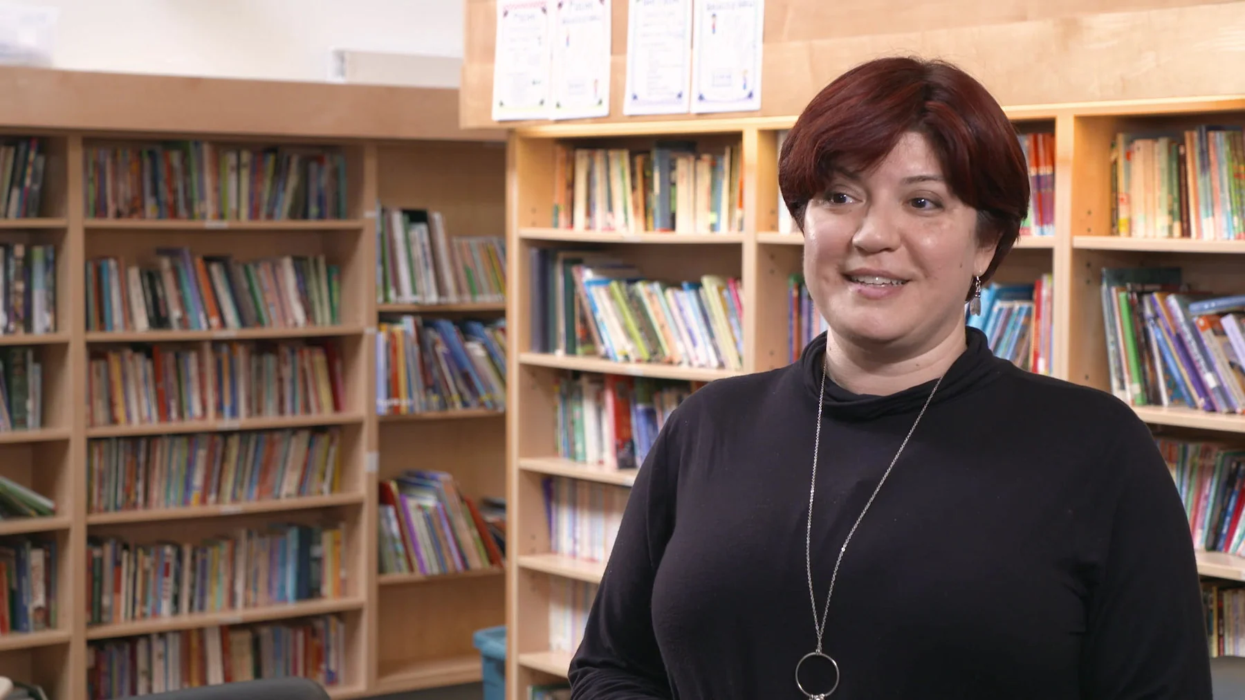An educator sharing her experience in a school library